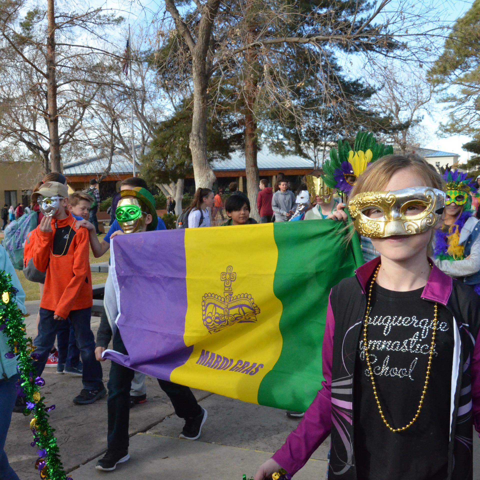 Mardi Gras Parade  Our French classes celebrate Mardi Gras each year with a parade of student-made floats on the Quad, jazz band students playing “When the Saints Go Marching In,” costumes, and food.
